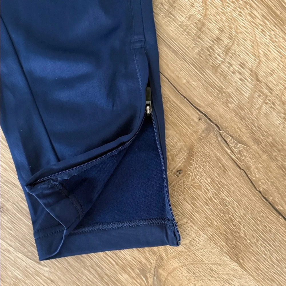 Nike Kids Navy Track Pants with White Side Stripes, Size Medium